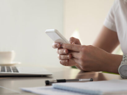Businesswoman looking important contact on phone